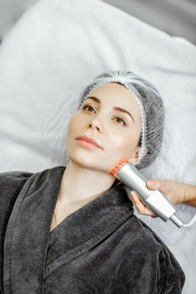 Woman during the facial treatment at the beauty salon